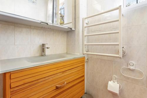 a bathroom with a sink and a mirror at Villa Sauvageonne in Saint-Raphaël