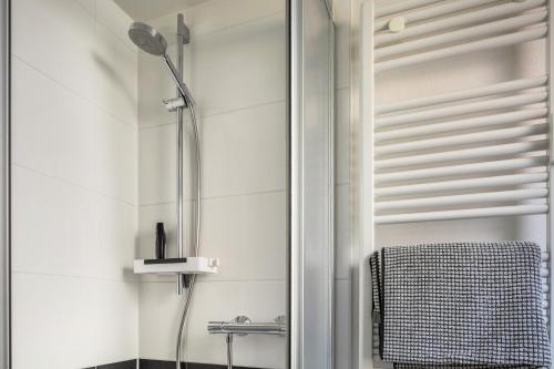 a shower in a bathroom with a glass door at Ferienwohnung Feine Natur in Bahlingen