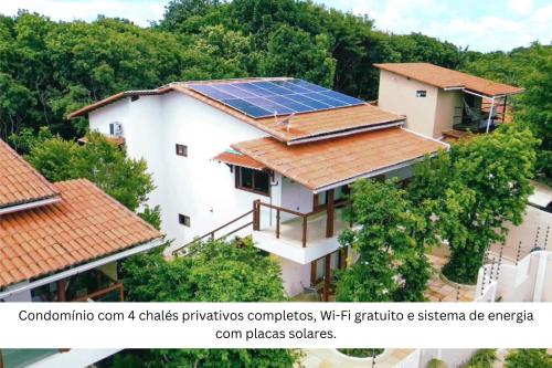 a building with a lot of solar panels on its roof at Lovely Pipa in Pipa