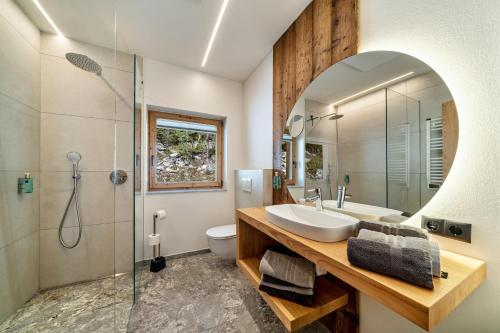 a bathroom with a sink and a shower at Grogg 608 Apt I I in Martello