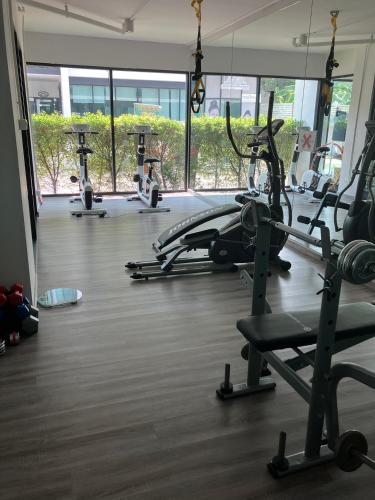 a gym with several tread machines in a room at 2 mins walk to BTS Bang Chak in Bangkok