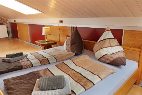 two beds in a room on a boat at Haus Schwanenweg in Konstanz