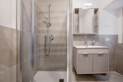 a bathroom with a shower and a sink at Casa Vera Aurora Lake Garda in Torri del Benaco