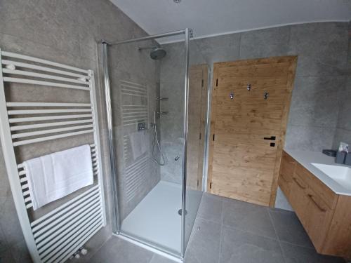 a bathroom with a shower and a sink at Ciasa De Marugiana in Gardeccia - San Giovanni di Fassa