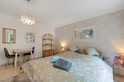 a bedroom with a bed and a table and a desk at Bei Annemarie in Trier
