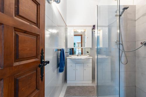 a bathroom with a glass shower and a sink at Mijas la Nueva in Mijas