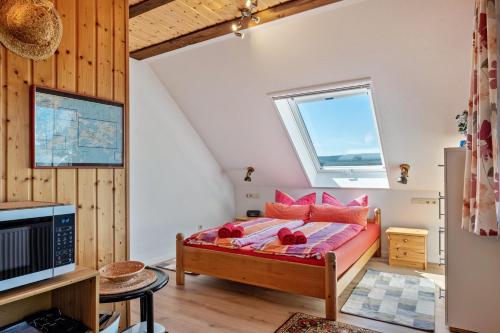 a bedroom with a bed and a window at Haus Leufke in Lenzkirch