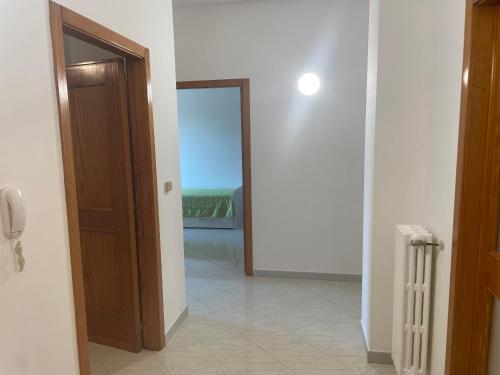 a hallway with a door to a room with a view at Massimo Holiday house in Acquarica del Capo