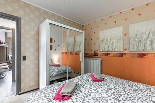 a bedroom with two beds and a mirror at Casa Heli 1 lake view in San Zeno di Montagna