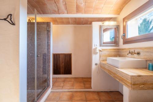 a bathroom with a sink and a shower at Finca Can Menut in Felanitx