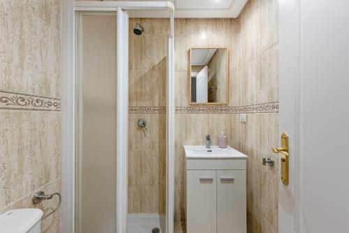 a bathroom with a shower and a sink and a toilet at Brisa del Puerto de la Duquesa in Manilva