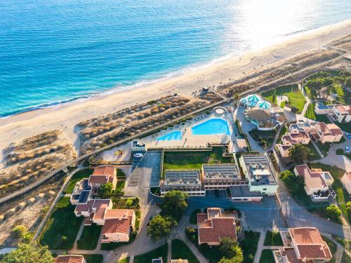 an aerial view of a resort next to the beach at Pestana Alvor Beach Villas Seaside Resort in Alvor