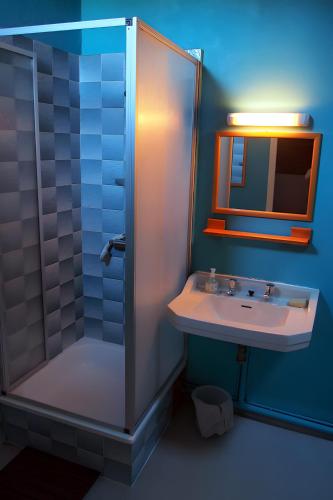 a bathroom with a sink and a shower at Gite De Cabrières in Compeyre