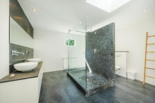a bathroom with a shower with a sink and a toilet at Ca Nostra in Port d'Andratx