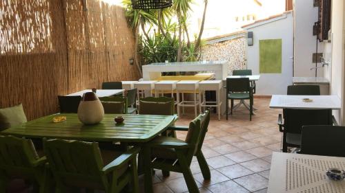 an outdoor patio with a table and chairs and a table and chairsktop at Bnb Sottosopra intero 3 stanze 8pax in Gallipoli