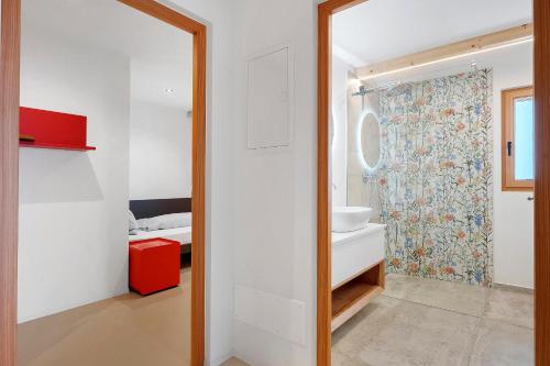 a bathroom with a sink and a mirror at Appartement Mia in San Genesio Atesino