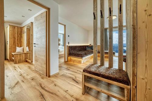 a room with a bed and a mirror at Hinterrainer Nature Apartments- New in Avelengo