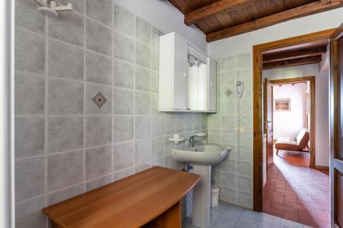 a bathroom with a sink and a mirror at Il Serrino 4 in Pistoia
