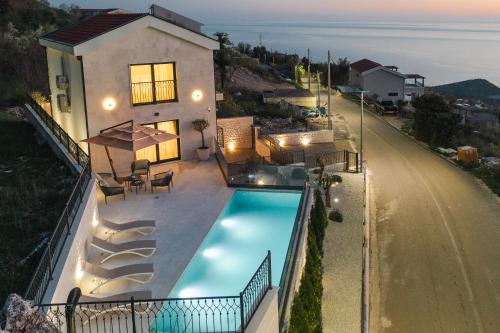an overhead view of a house with a swimming pool at Boutique Villa Levante in Blizikuće