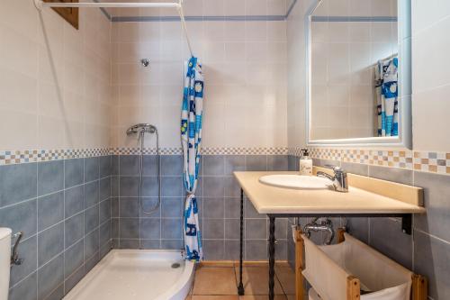 a bathroom with a sink and a tub and a toilet at Cortijo El Plantío Castril in Castril