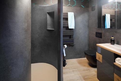a bathroom with a toilet and a sink at Happy Place in Ilmenau