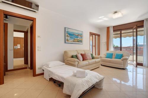 a living room with two couches and a table at Casa Andrea in Venice