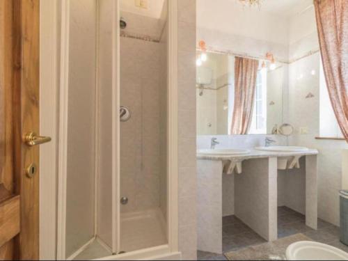 a bathroom with a shower and a sink and a toilet at Il Giardino Etrusco Bolsena in Bolsena