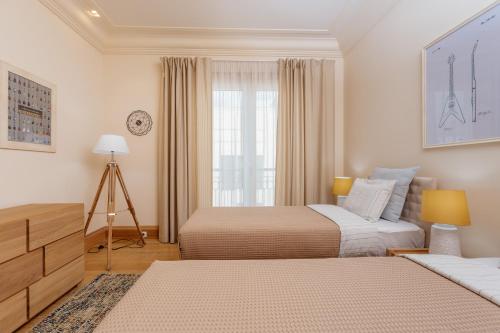 Кровать или кровати в номере Porto Montenegro Luxury Experience