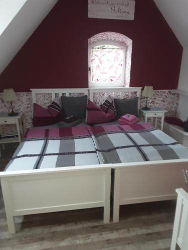 a bedroom with a large bed in a attic at Garten der Ruhe in Osterbuch