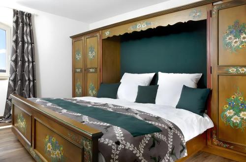 a bedroom with a large bed with a canopy at Hotzenwald in Ibach