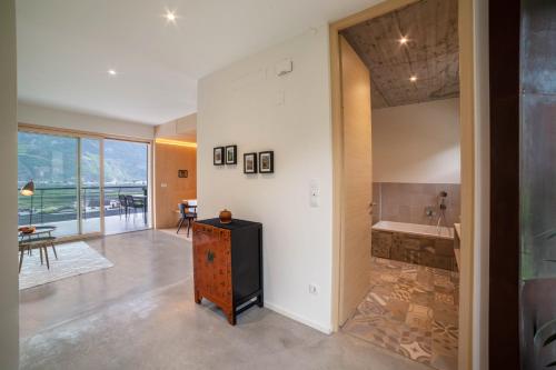 a bathroom with a tub and a sink in a room at Apartment Das Runde in Cermes