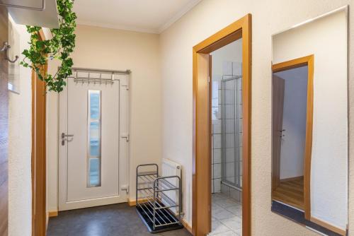 a hallway with a mirror and a walk in closet at Apart Bergtraum Ried - Typ 1 in Ried im Oberinntal