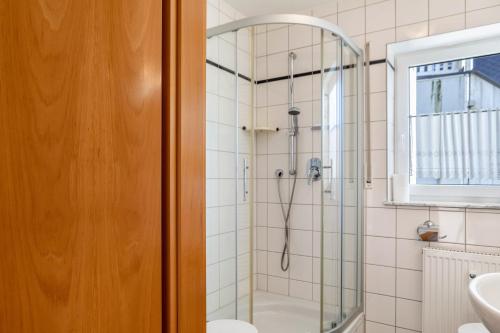 a bathroom with a shower and a sink at Ferienwohnung Tannenblick 1-1 in Oberhof