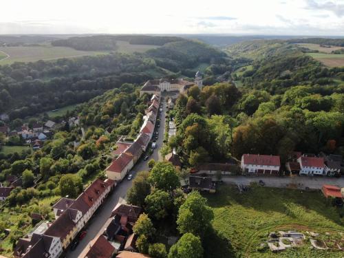 an aerial view of a small town with a train at Ferienwohnung im Hofratshaus in Schrozberg