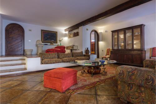 a living room with couches and a table at Gli Archi with pool - Lecce in Lecce