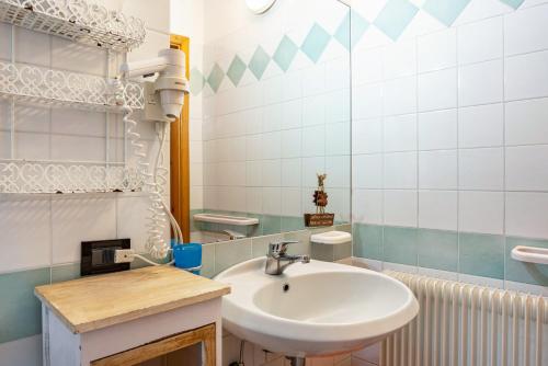 a bathroom with a sink and a mirror at Agritur Solasna in Caldes