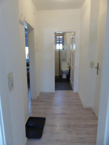 a hallway leading to a bathroom with a toilet at Ferienwohnung in Hof Saale in Hof