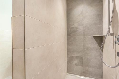 a shower with a glass door in a bathroom at Luisalle Top 2 in Auffach