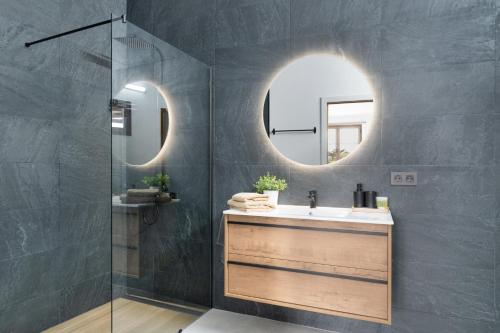 a bathroom with a sink and a mirror at Casita Lanzarote in Teguise