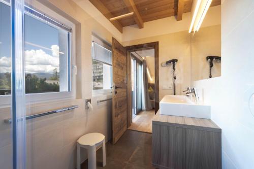 a bathroom with a sink and a window at Sonnleiten Sterngucker 10 in Collepietra