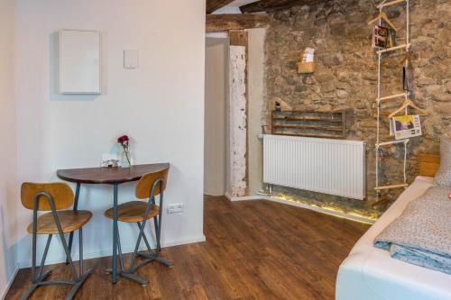 a room with a small table and two chairs at Fewo Sankt Johann I in Konstanz
