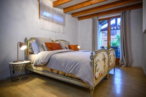 a bedroom with a bed and a window at Chalet du cret in Lathuile