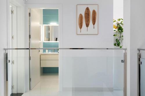 a white kitchen with a refrigerator and a sink at Brisa 3 in La Santa