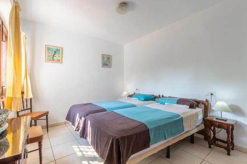 a bedroom with a large bed in a room at Villa Margarita in Benissa
