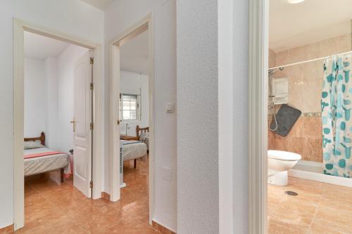 a bathroom with a sink and a toilet in a room at Casa del mar Salobreña in Salobreña