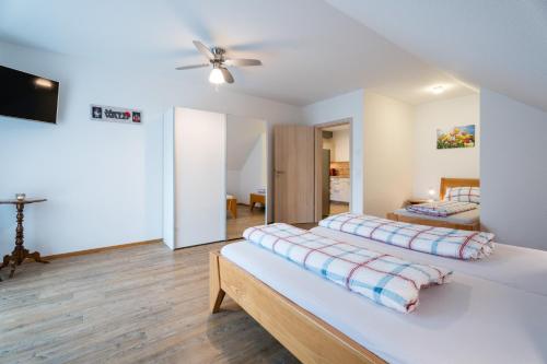 a bedroom with a bed with two pillows on it at Ferienwohnungen Beilerstädtle in Oppenau