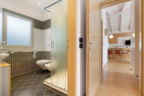 a bathroom with a toilet and a sink at Casa-lago suite 55 in Brenzone sul Garda