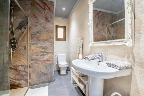 a bathroom with a sink and a shower at Ca Na Kika in Alcudia