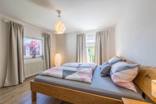 a bedroom with a large bed in a room at Ferienwohnung Selina in Taching am See