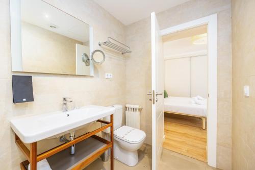 a bathroom with a sink and a toilet at Hostal Boutique Canyamel in Canyamel